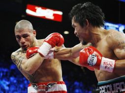 El puertorriqueño Miguel Cotto (izq.), campeón súper welter de la Asociación Mundial de Boxeo. ARCHIVO  /