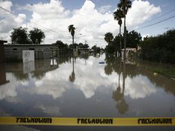 Habitantes de Anáhuac, Nuevo León, fueron evacuados ante el desfogue de una presa en riesgo de desbordarse por las fuertes lluvias. AP  /