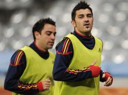 Xavier Hernández y David Villa trotan en el entrenamiento de la “Furia”. GETTY IMAGES SPORT  /