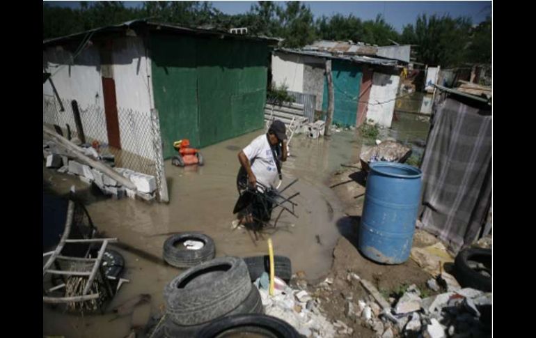 Daños ocasionados por el huracán Alex y sus efectos como las intensas lluvias e inundaciones de días pasados. AP  /