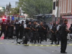 Agentes federales aseguran el área donde se presentó el atentado. AP  /