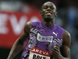 Usaín Bolt ganó su esperado duelo con Asafa. AP  /