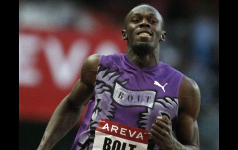 Usaín Bolt ganó su esperado duelo con Asafa. AP  /