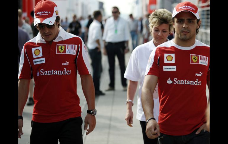 Fernando Alonso y Felipe Massa al momento de llegar al Hungaroring. AFP  /