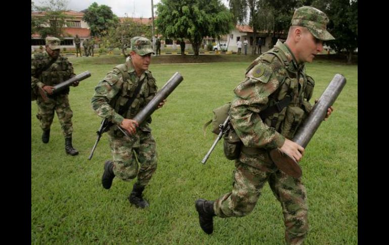 Se conocen a los 'falsos positivos' a los asesinatos presentados a la opinión pública como guerrilleros por el Ejército. AP  /