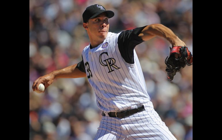 El pitcher de los Rockies se apuntó la victoria ante los Reds. AFP  /