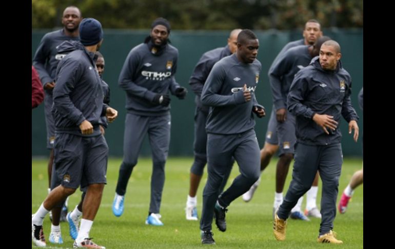 Los jugadores del Manchester City se preparan para enfrentar al Juventus. AP  /