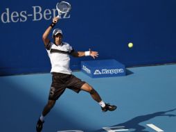 El tenista serbio Novak Djokovic reacciona en su encuentro ante Gong Maoxin. AP  /