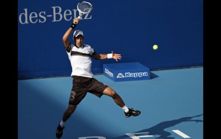 El tenista serbio Novak Djokovic reacciona en su encuentro ante Gong Maoxin. AP  /