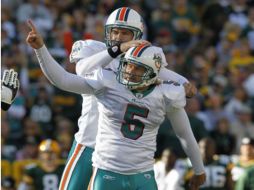 Los jugadores de Delfines de Miami festejando su victoria. AP  /