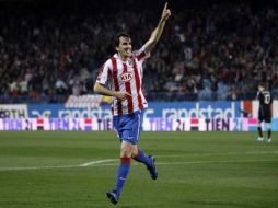 El jugador uruguayo Diego Godín festejando el gol que marcó para el Atlético de Madrid. AP  /