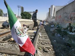 Migrantes nacionales y extranjeros hacen ‘escala’ en la colonia Ferrocarril, a mitad de camino de su viaje a EU. A. GARCÍA  /