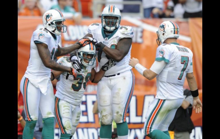 Los jugadores de Delfines festejando su victoria. AP  /