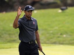 Woods tiene 131 golpes en total, 13 bajo par. AP  /