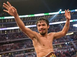 Pacquiao celebra tras derrotar a Clottey, en marzo pasado, uno de sus dos combates de 2010. AFP  /