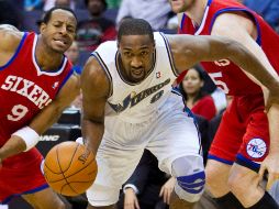 El base Gilbert Arenas, en un partido contra los 76ers. AP  /