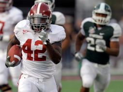 El corredor Eddie Lacy llega a la zona de anotación y marca para Alabama, en la segunda mitad del Tazón Capital One. AP  /