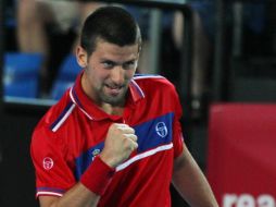 El tenista serbio Novak Djokovic festeja su victoria. AFP  /