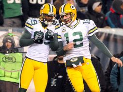 El receptor James Jones (izq.) y el mariscal Aaron Rodgers, de Green Bay, celebran una anotación. AP  /