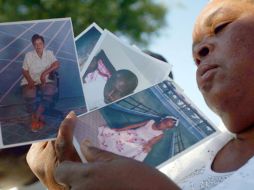 Los haitianos portaban fotografías de sus familiares y algunos más lamentaban la falta de apoyo internacional. AFP  /