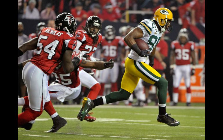 Greg Jennings, de Green Bay, corre para llegar a zona de anotación. REUTERS  /