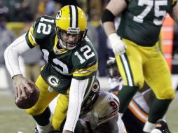 Aaron Rodgers (12) de los Empacadores, es gran amigo del mariscal de los Osos de Chicago, Jay Cutler. AP  /