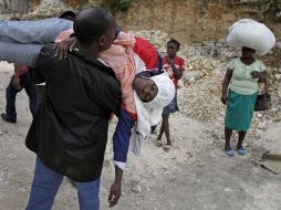 Decenas de haitianos han sido expulsados de distintos barrios del país por dominicanos que les acusan de cometer actos delictivos. AP  /