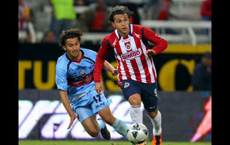 Omar Arellano y Daniel Guerrero de Atlante, durante juego de la semana 5 del Clausura 2011. MEXSPORT  /