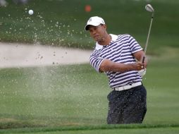 A pesar del mal momento de Tiger Woods, no baja los brazos y buscará cumplir su objetivo. AP  /