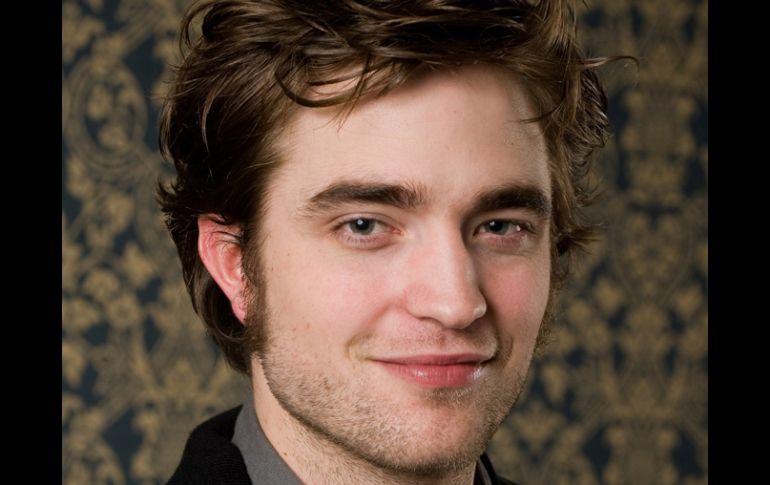 Antes que con adultos, el actor Robert Pattinson prefiere trabajar con animales y niños. AP  /