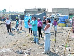 Vecinos de la colonia Lomas de la Primavera denuncian que el desalojo se efectuó con violencia. E. BARRERA  /