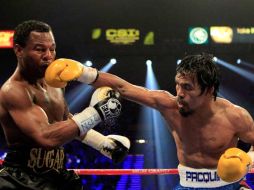 Manny Pacquio (der.) se lleva otra victoria ante un rival fuerte. AFP  /