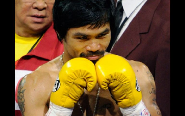 Manny Pacquiao antes de comenzar la pelea para retener su título welter de la OMB. AFP  /