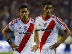 Los elementos de River Plate se lamentan de la derrota ante Boca Juniors. AFP  /