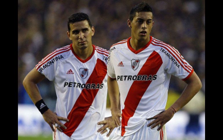 Los elementos de River Plate se lamentan de la derrota ante Boca Juniors. AFP  /