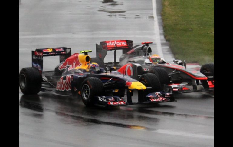 Mark Webber (izq), piloto de la escudería Red Bull, durante en Gran Premio de Canadá. AP  /