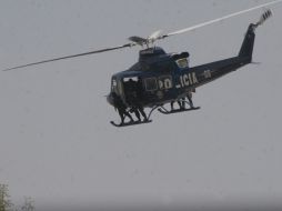 Elementos del Grupo Fuerza de Tarea patrullan la ciudad de México a bordo de helicópteros, durante el operativo. NTX  /