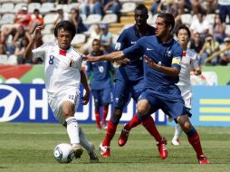 Jugadores de la selección de Francia y Japón durante partido del Mundial Sub-17 celebrado en Monterrey. MEXSPORT  /