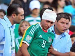 Julio Gómez tuvo un choque fuerte de cabezas en la jugada del gol olímpico en el partido contra Alemania. EFE  /