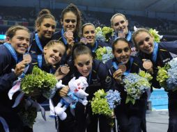 El equipo español celebra su quinta de bronce dentro del Centro de deportes oriental. AFP  /