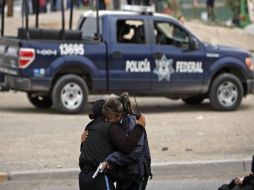 Piden que la policía municipal se sume al esfuerzo de la Policía Federal contra el crimen en Juárez. AFP  /