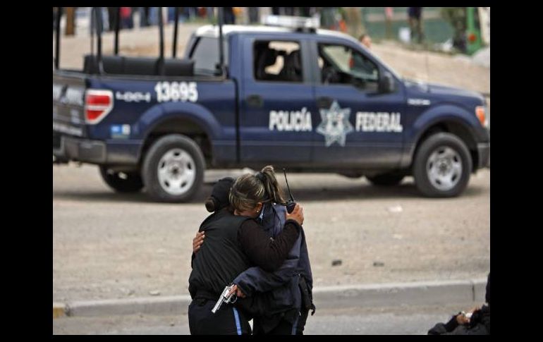 Piden que la policía municipal se sume al esfuerzo de la Policía Federal contra el crimen en Juárez. AFP  /