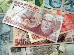 Los temores de una posible recesión económica en Estados Unidos continúan presionando la paridad del peso mexican. ARCHIVO  /