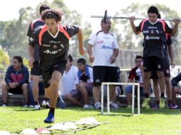 Jugadores 'rojinegros' durante una práctica en el club dell equipo. EL INFORMADOR  /