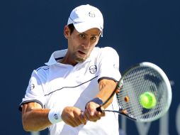 El tenista serbio Novak Djokovic enfrenta a Conor Niland en partido de primera ronda del US Open. AFP  /