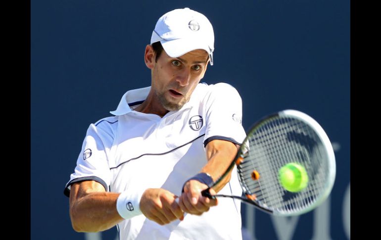 El tenista serbio Novak Djokovic enfrenta a Conor Niland en partido de primera ronda del US Open. AFP  /