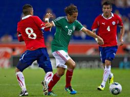 Andrés Guardado (c) fue el autor del gol de la victoria mexicana ante Chile. MEXSPORT  /