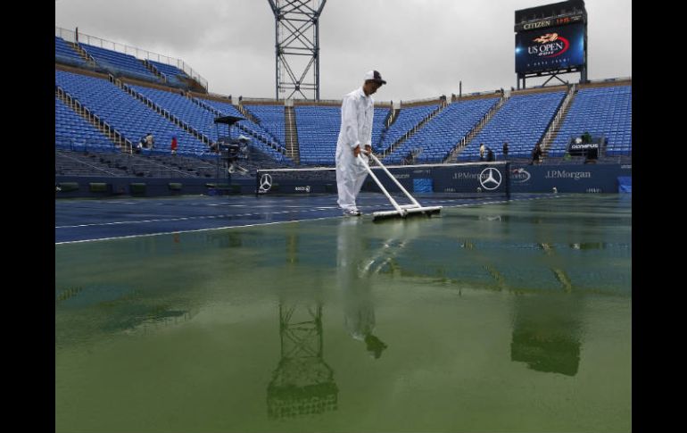 Se espera que por lo menos se puedan jugar los partidos del cuadro masculino. AP  /