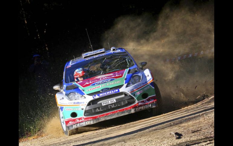 Mikko Hirvonen y su copiloto Jarmo Lehtinen en el Rally de Australia. AP  /