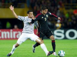 El futbolista jalisciense (D) jugó pocos minutos durante el partido, pero logró ser tomado en cuenta pos su técnico. MEXSPORT  /